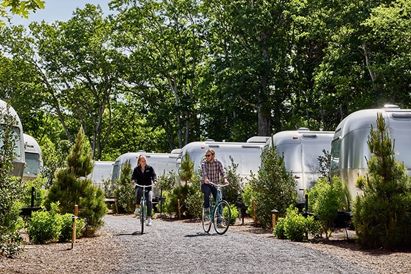 Unique event venue, Autocamp airstreams lined up near a forest