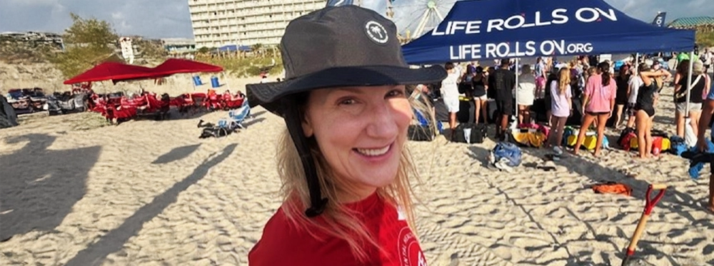 Tracey gets ready for a full day of surfing with Life Rolls On